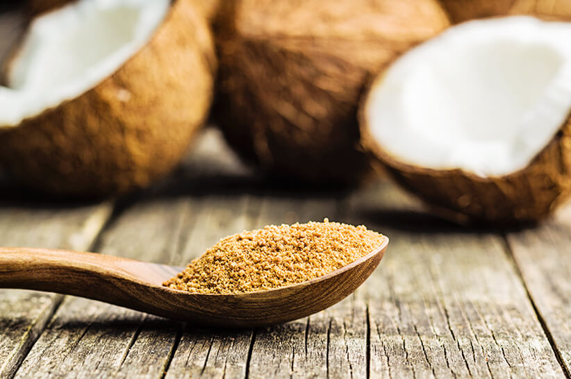 coconut sugar in a wooden spoon