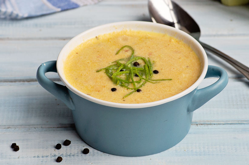 keto egg drop soup with spoon in the background