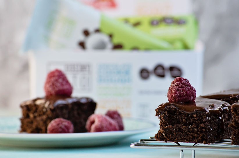 two keto brownies with raspberry on top